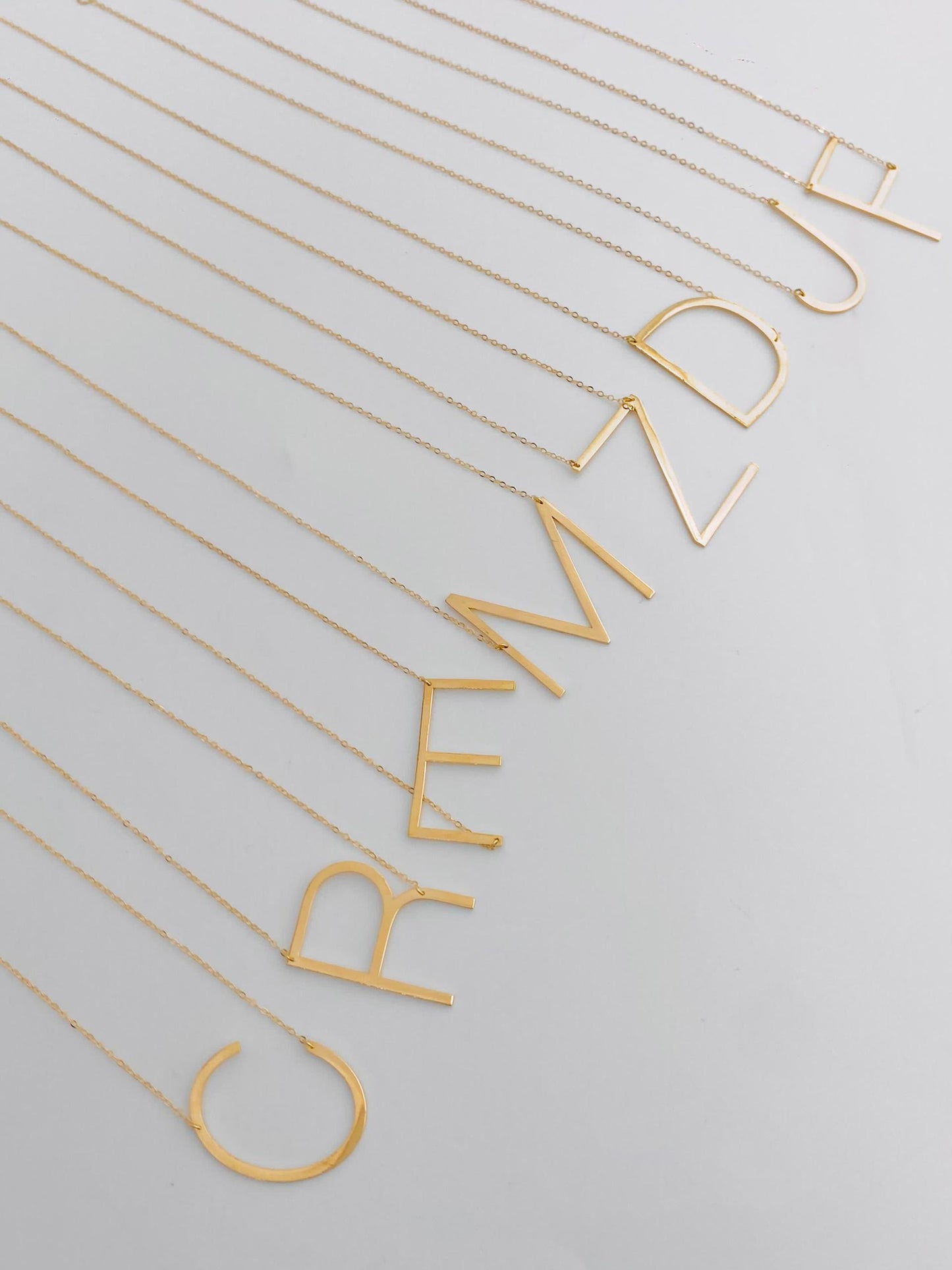 18 Carat Gold lettered necklace (R)